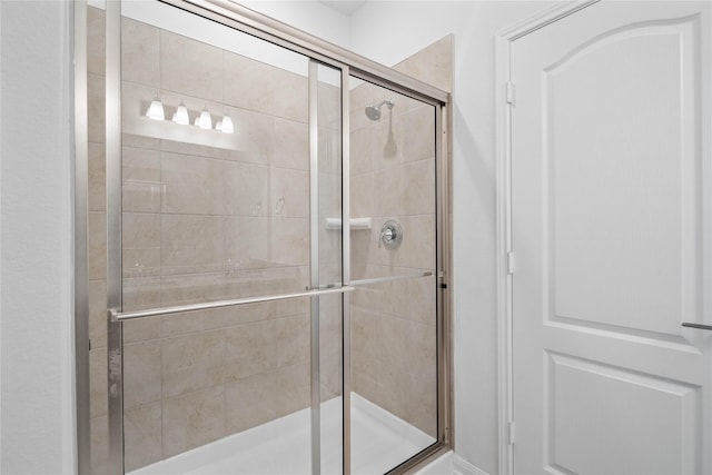 bathroom featuring a stall shower