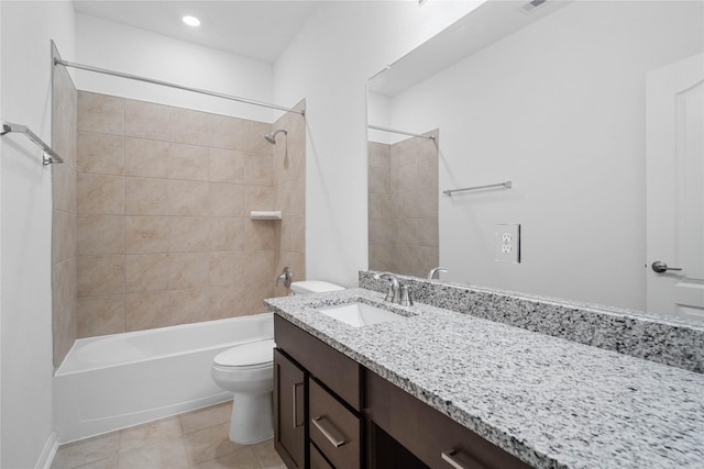 bathroom featuring vanity, tub / shower combination, tile patterned flooring, and toilet