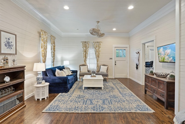 living area with wooden walls and dark wood-type flooring