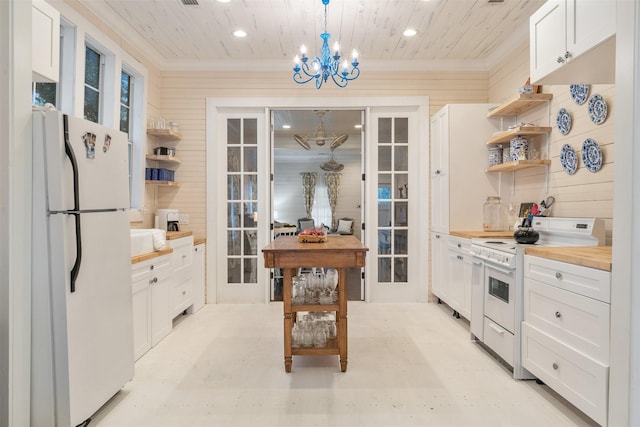 kitchen with white cabinetry, french doors, butcher block countertops, pendant lighting, and white appliances