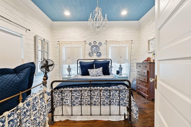 bedroom featuring wooden ceiling, wood-type flooring, wooden walls, and a chandelier