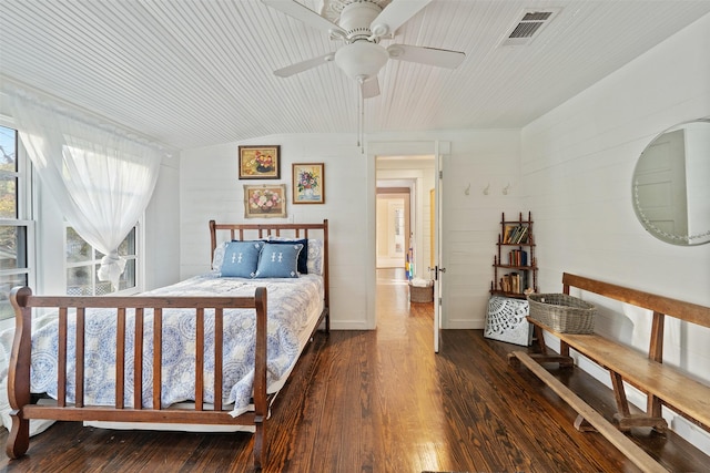 bedroom featuring ceiling fan, dark wood-type flooring, and lofted ceiling