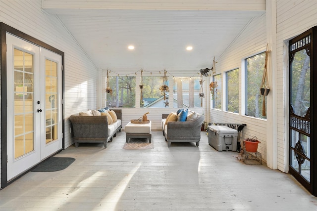 sunroom / solarium featuring french doors, lofted ceiling with beams, and wooden ceiling