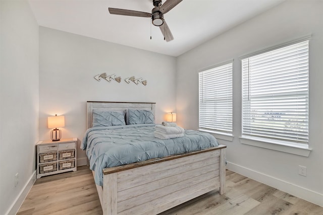 bedroom featuring ceiling fan and light hardwood / wood-style flooring