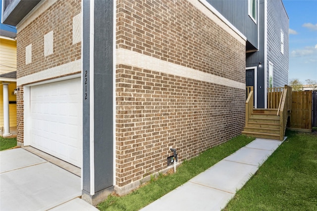 view of side of home with a garage