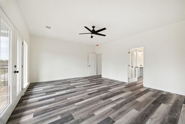 unfurnished room featuring ceiling fan, plenty of natural light, and dark hardwood / wood-style floors