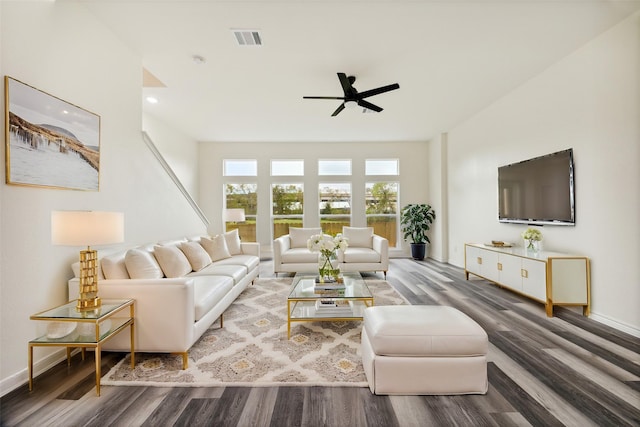 living room with ceiling fan and hardwood / wood-style floors