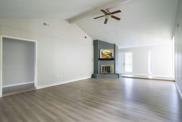 unfurnished living room with beamed ceiling, wood-type flooring, a large fireplace, and ceiling fan