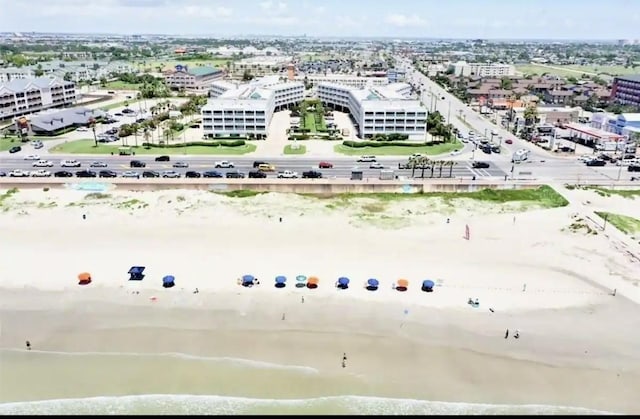 aerial view with a water view and a view of the beach