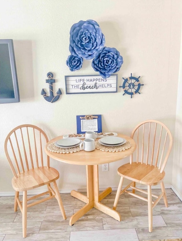 dining area with hardwood / wood-style floors