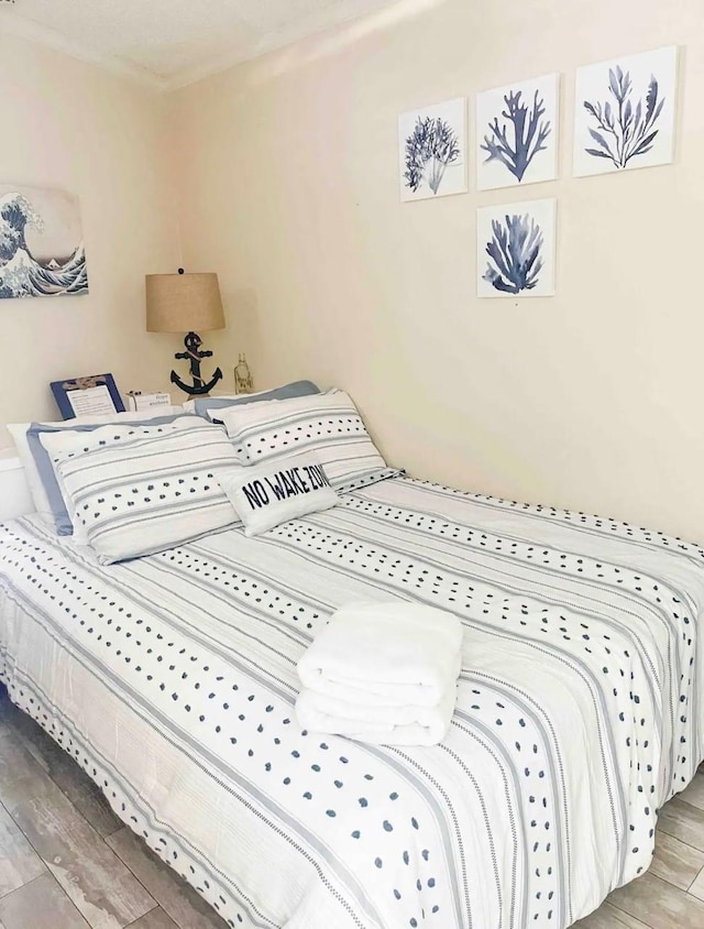 bedroom featuring hardwood / wood-style floors