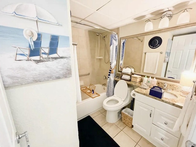 full bathroom featuring tile patterned floors, vanity, toilet, and shower / bath combo with shower curtain