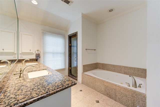 bathroom featuring tile patterned floors, crown molding, vanity, and a relaxing tiled tub