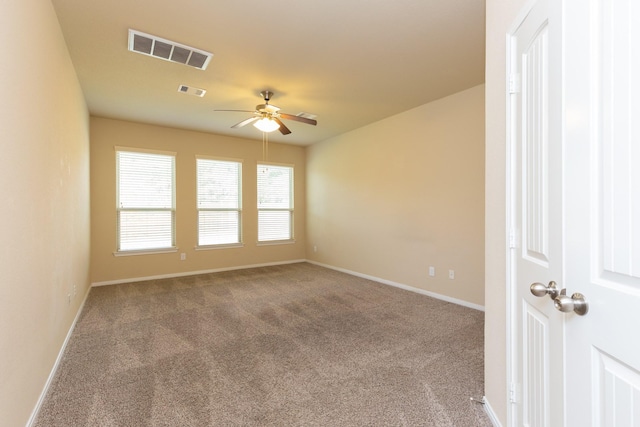 carpeted empty room with ceiling fan