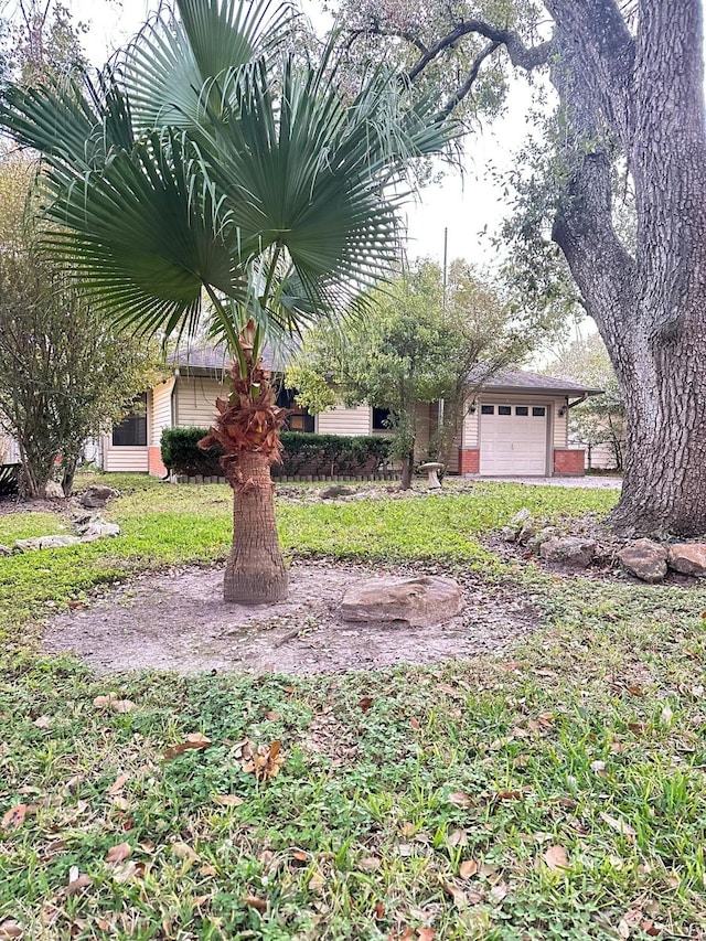 view of yard featuring a garage