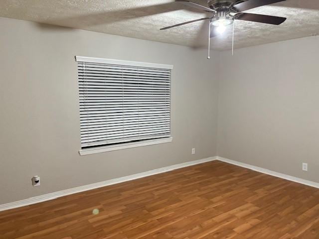 unfurnished room featuring wood-type flooring, a textured ceiling, and ceiling fan