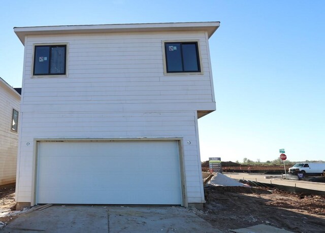 exterior space with a garage