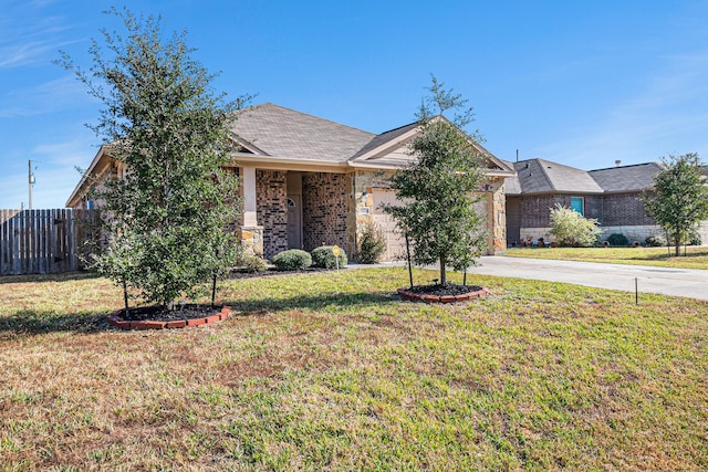 view of property hidden behind natural elements with a front lawn