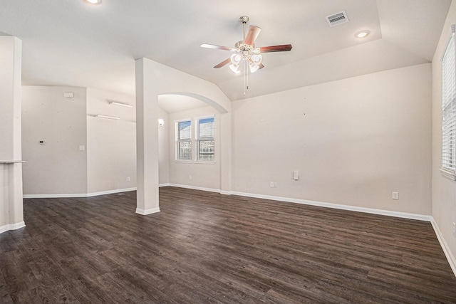 unfurnished room featuring dark hardwood / wood-style floors, ceiling fan, and vaulted ceiling