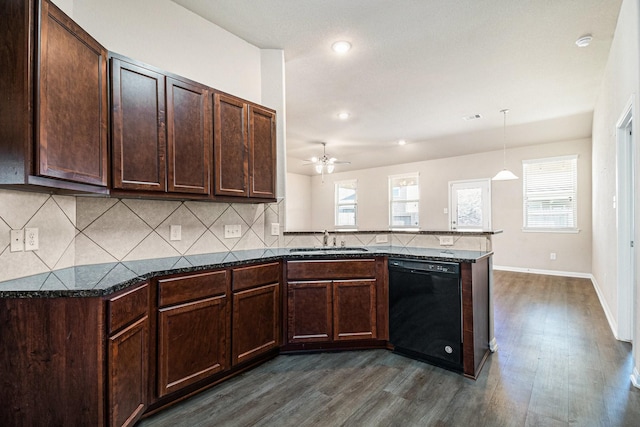 kitchen featuring sink, black dishwasher, dark hardwood / wood-style floors, kitchen peninsula, and decorative light fixtures