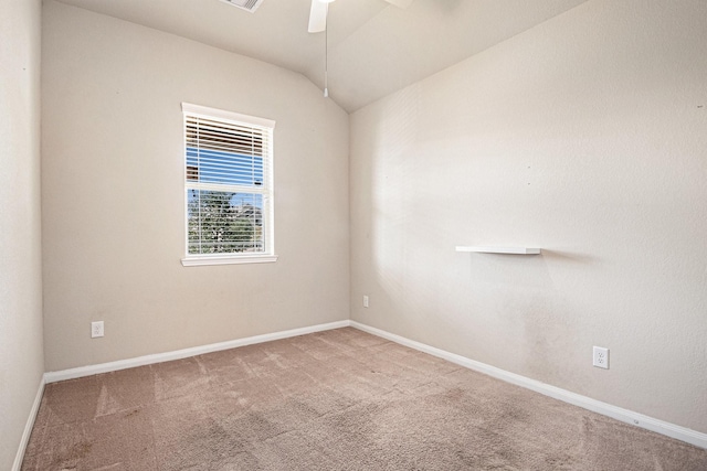 empty room featuring carpet, ceiling fan, and lofted ceiling