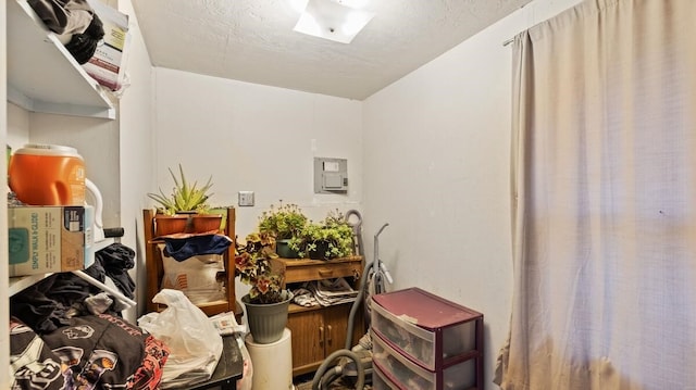 miscellaneous room with a textured ceiling