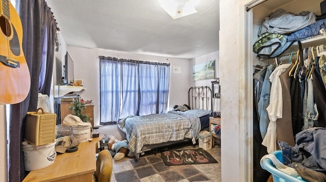 bedroom featuring a textured ceiling