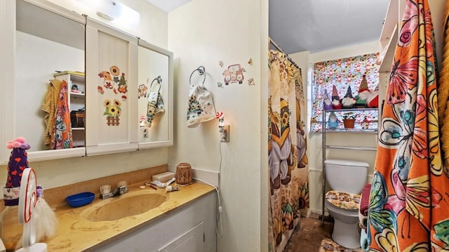 bathroom with vanity and toilet