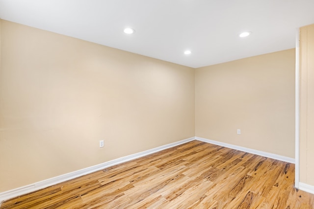 empty room with light hardwood / wood-style flooring