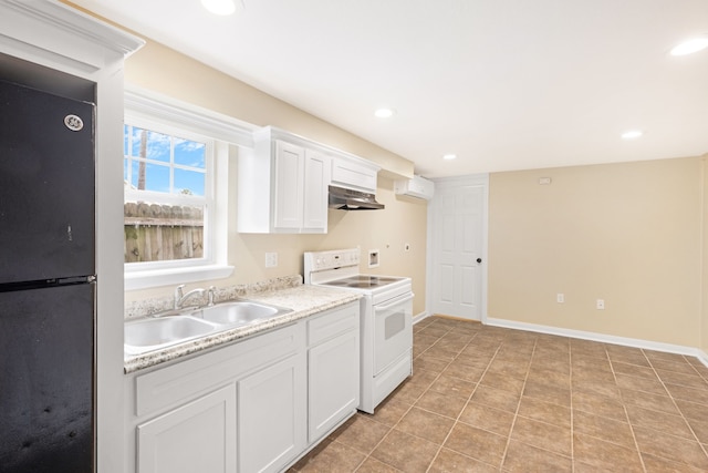 kitchen with black fridge, extractor fan, white range with electric stovetop, sink, and white cabinets