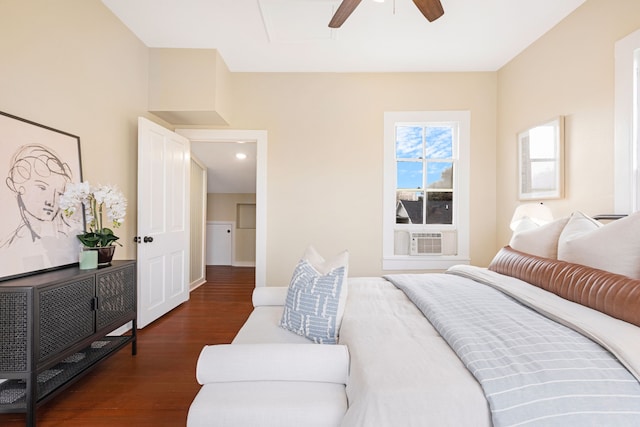 bedroom featuring ceiling fan, cooling unit, and dark hardwood / wood-style flooring