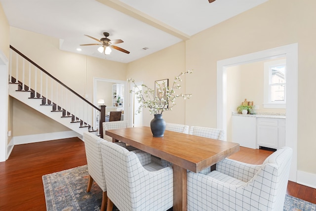 dining room featuring ceiling fan and dark hardwood / wood-style flooring