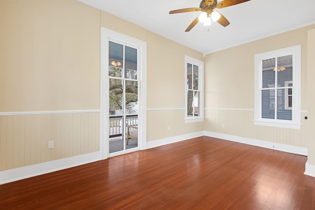 empty room with ceiling fan and wood-type flooring