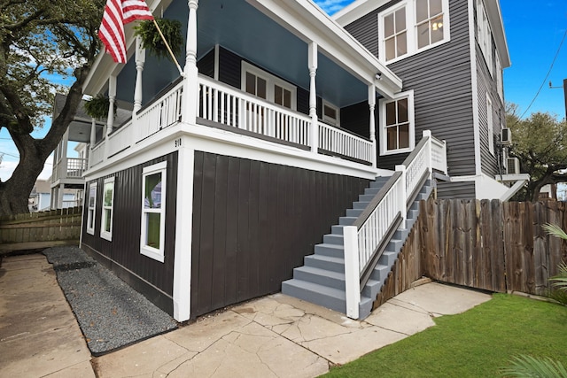 view of side of home with a balcony