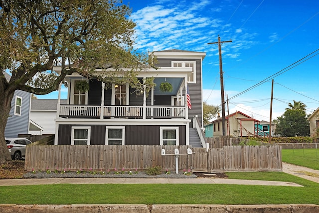 view of front facade with a balcony