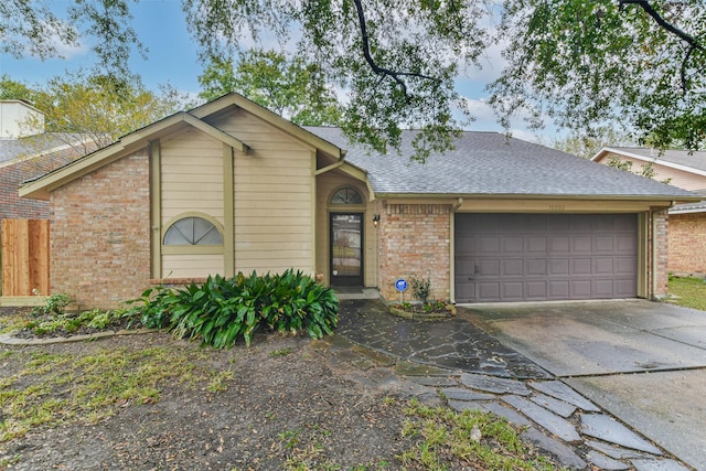 10306 Wayward Wind Ln, Houston, TX 77064 - view of front of house featuring brick siding, a garage, a shingled roof, and concrete driveway