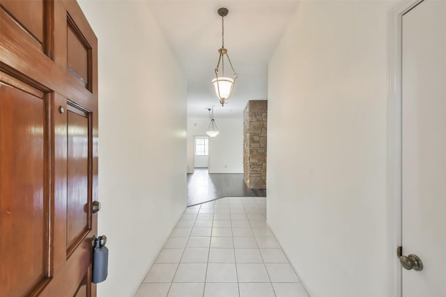 hall with light tile patterned floors