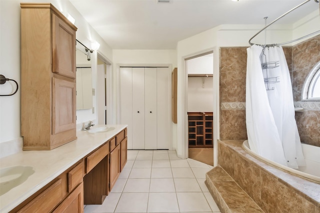 10306 Wayward Wind Ln, Houston, TX 77064 - bathroom with double vanity, tiled shower / bath combo, and tile patterned floors