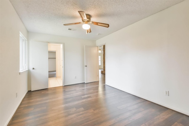 10306 Wayward Wind Ln, Houston, TX 77064 - unfurnished bedroom featuring wood finished floors, a textured ceiling, and ceiling fan