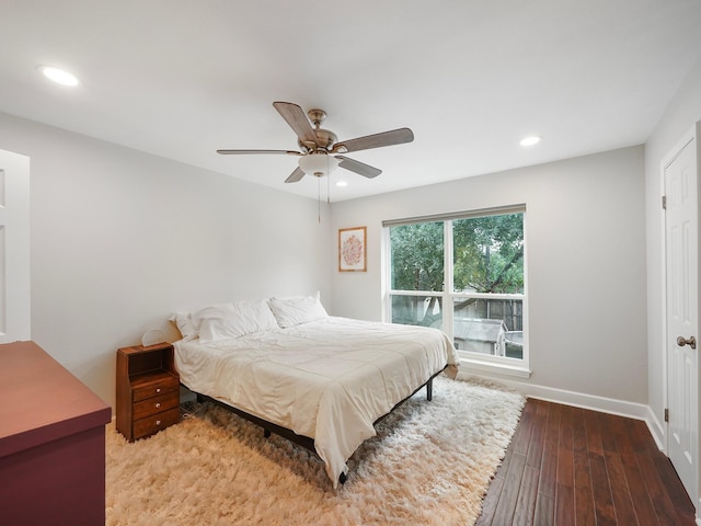 bedroom with ceiling fan and wood-type flooring