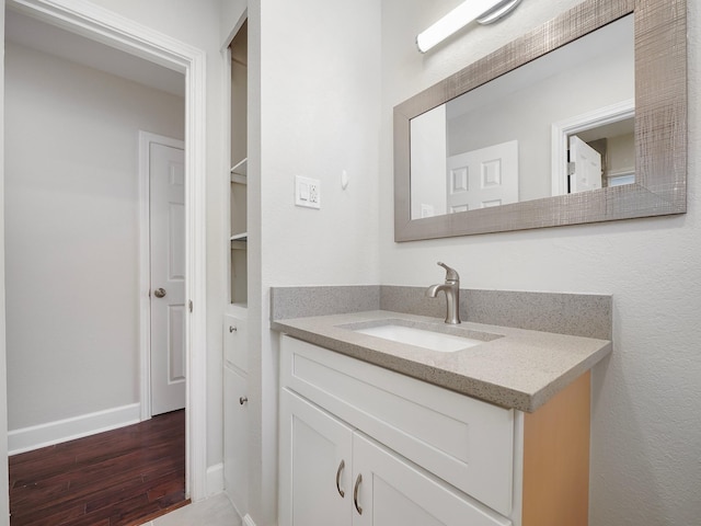 bathroom with wood-type flooring and vanity