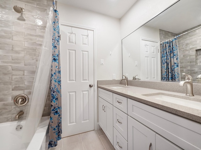 bathroom with shower / tub combo, vanity, and tile patterned floors