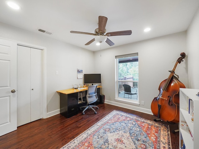 office with dark hardwood / wood-style floors and ceiling fan