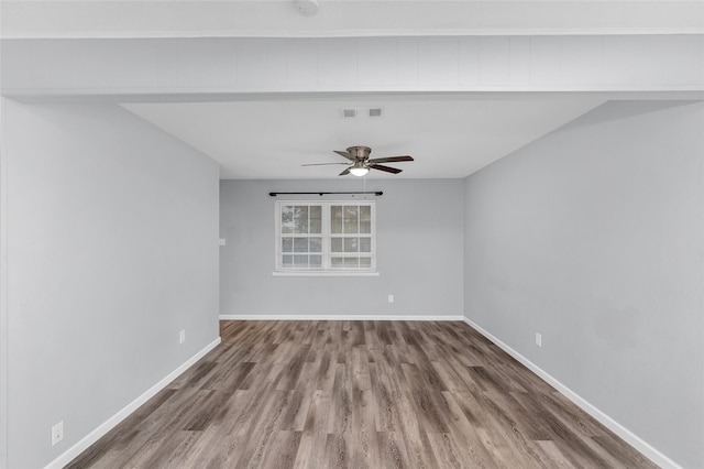 spare room featuring ceiling fan and hardwood / wood-style flooring