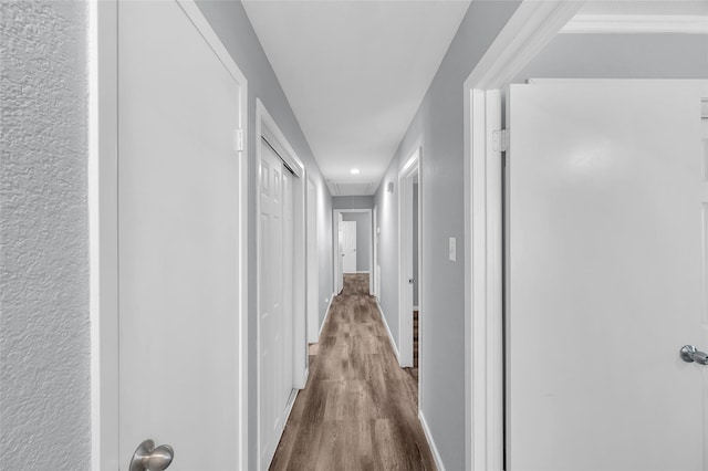 corridor featuring hardwood / wood-style floors