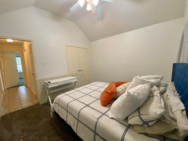 bedroom with carpet floors, a closet, ceiling fan, and lofted ceiling