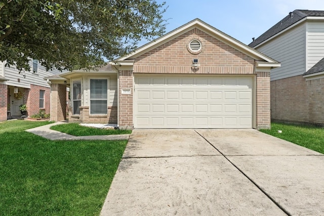 ranch-style home with driveway, a front yard, a garage, and brick siding