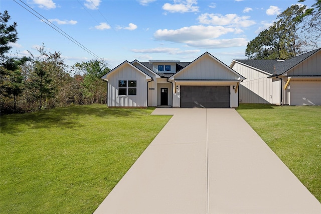 modern farmhouse featuring a front lawn and a garage