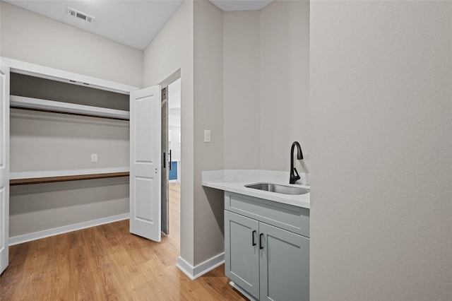 interior space with hardwood / wood-style floors and sink