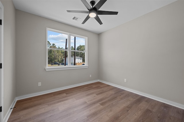 spare room featuring ceiling fan and light hardwood / wood-style flooring